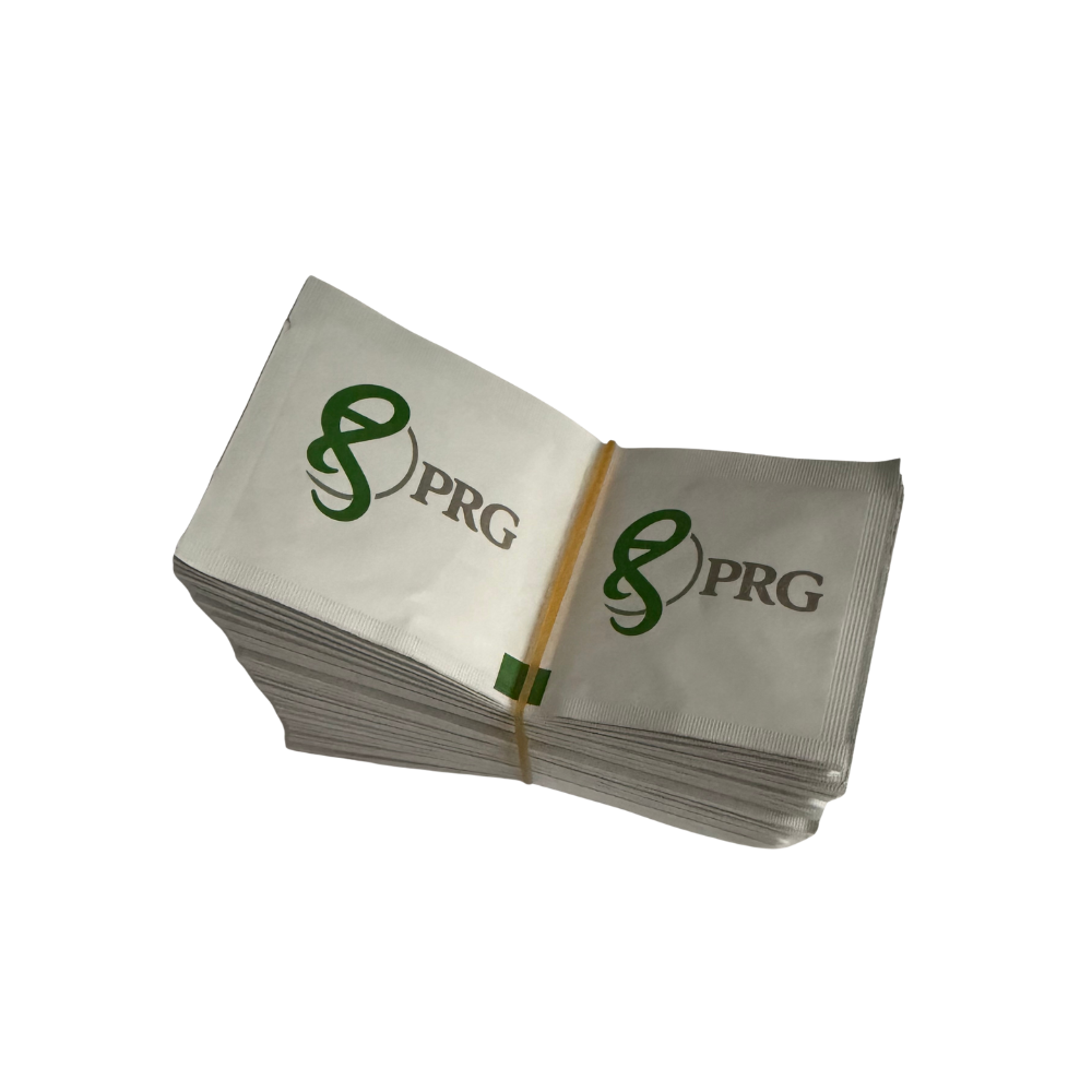 A stack of white PRG branded alcohol pads tied together with a rubber band, shown on a plain white background.